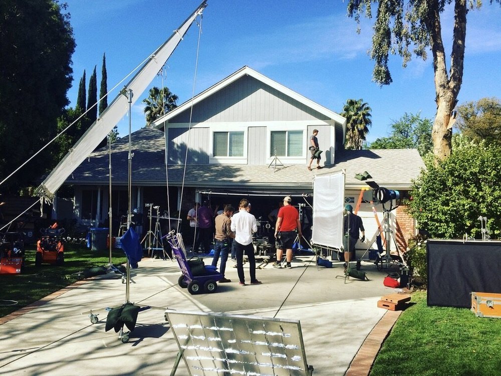Commercial — crane and silks rigged over a backyard set